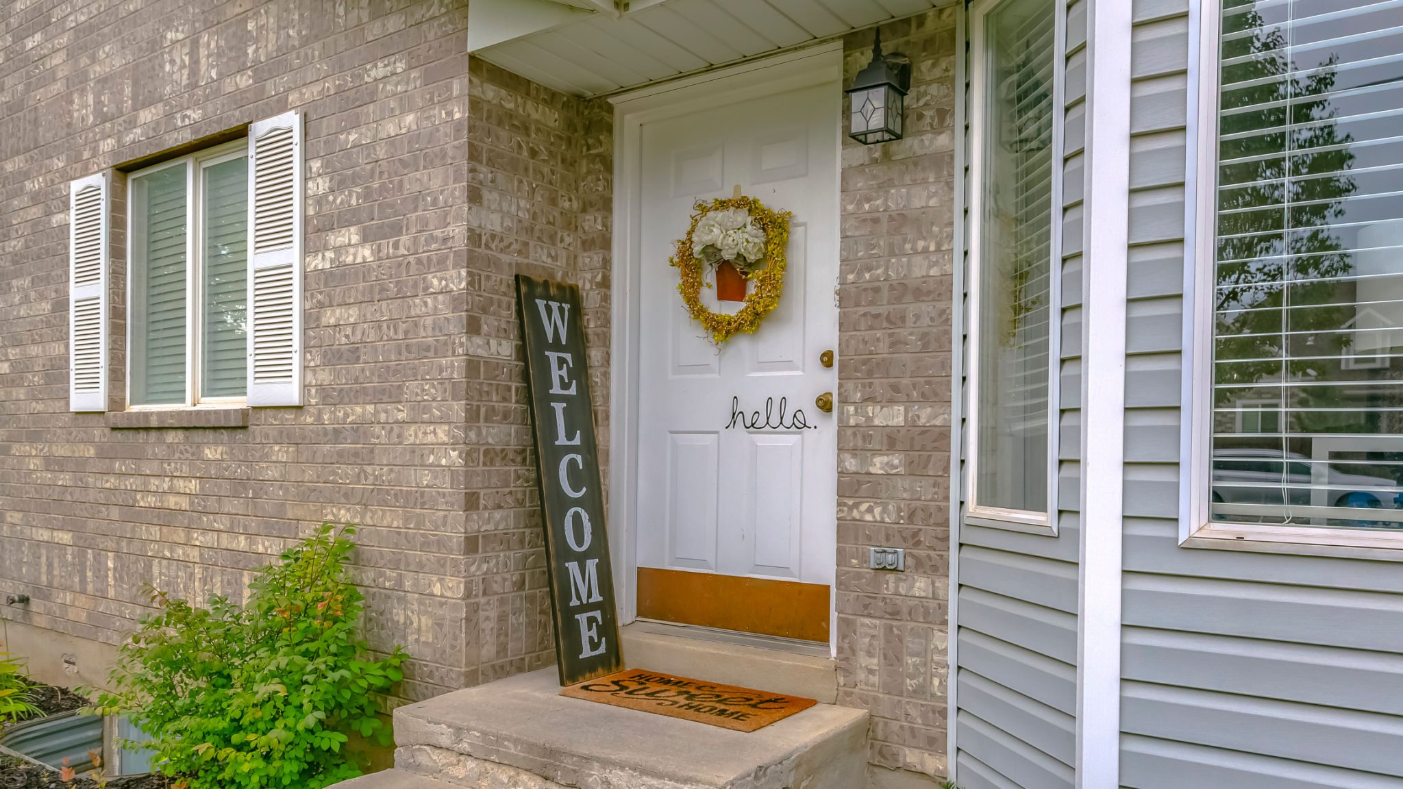 Front porch with welcome sign