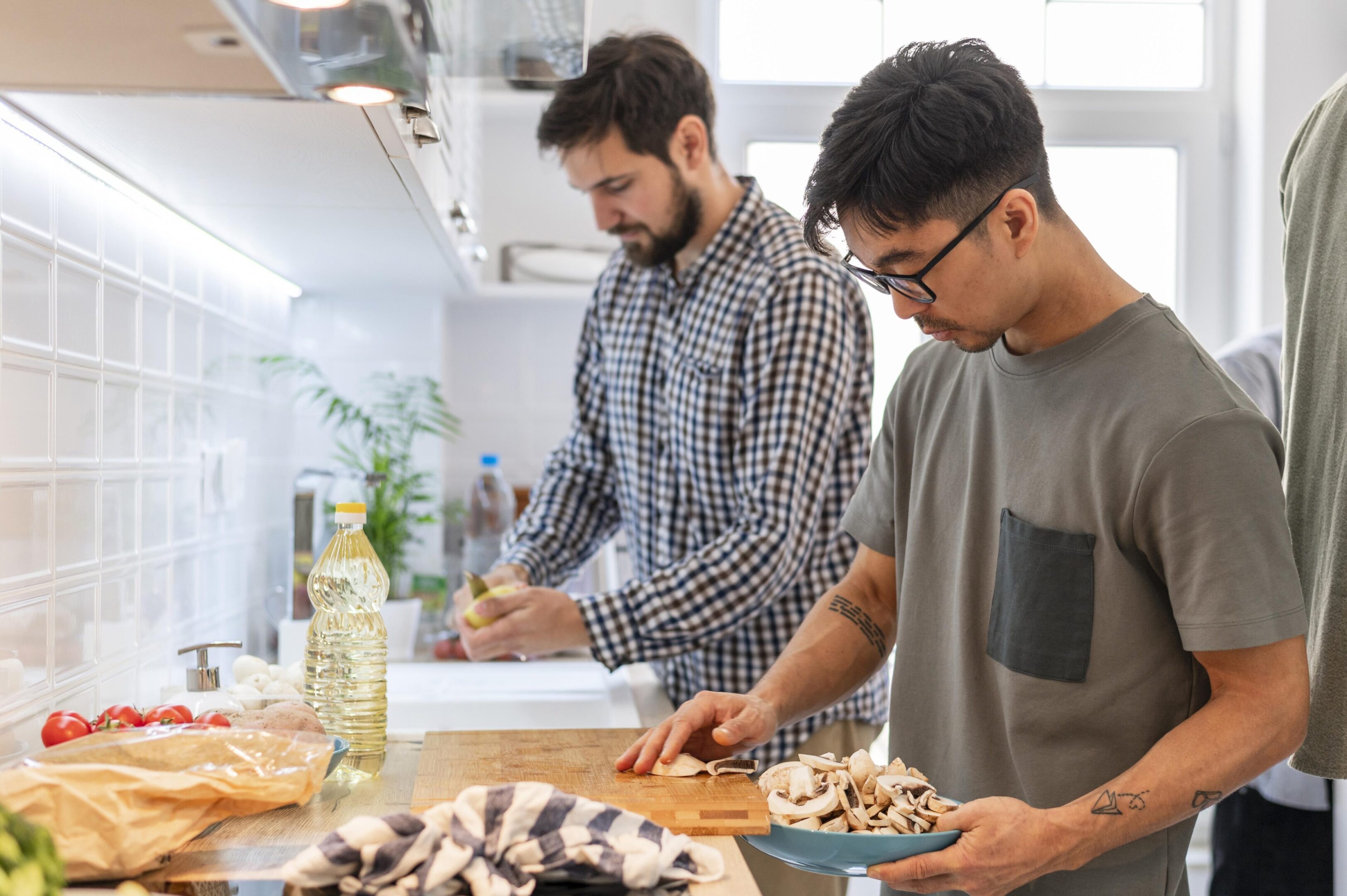 close-up-roommates-cooking-together